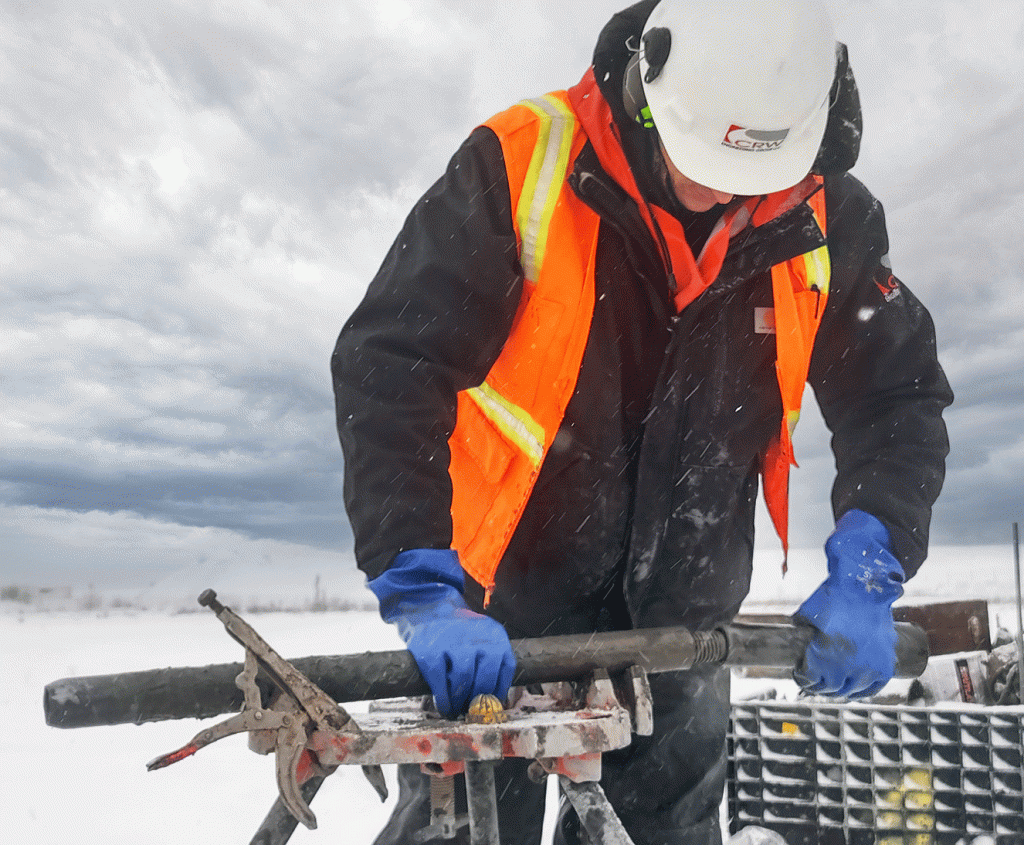 CRW Engineering Group employee working outside in Alaska on a geotechnical engineering project.